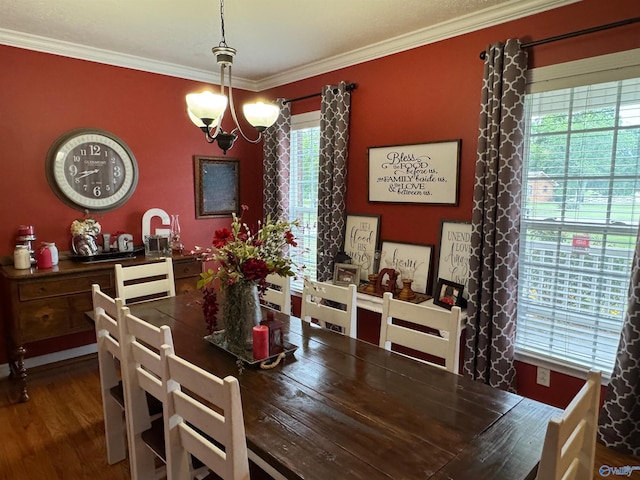 3648 Turnpike Rd, Albertville, AL 35950 - dining room with crown molding, wood finished floors, and a chandelier