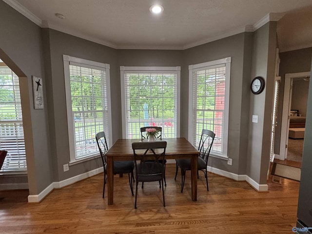 3648 Turnpike Rd, Albertville, AL 35950 - dining space featuring light wood-style floors, crown molding, and baseboards