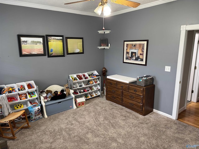 3648 Turnpike Rd, Albertville, AL 35950 - playroom featuring crown molding, a ceiling fan, carpet floors, and baseboards
