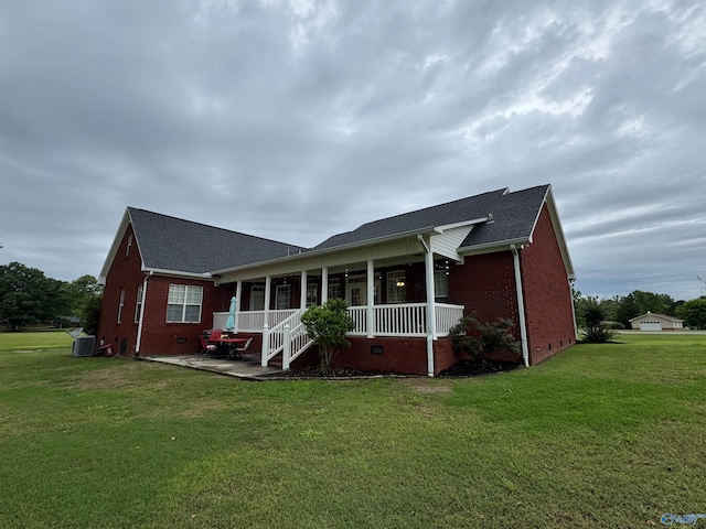3648 Turnpike Rd, Albertville, AL 35950 - back of house with cooling unit, brick siding, a yard, and a shingled roof