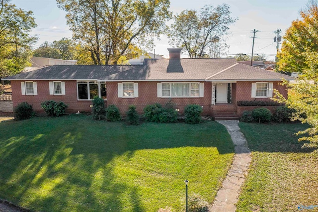 ranch-style home with a front yard