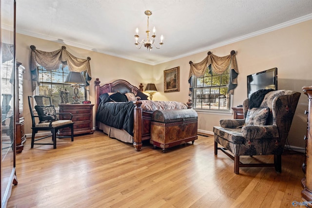 bedroom featuring crown molding, an inviting chandelier, and light wood-type flooring