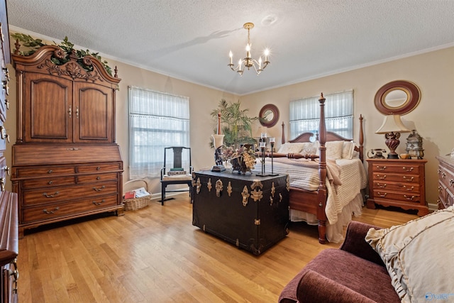 bedroom featuring crown molding, light hardwood / wood-style flooring, and multiple windows