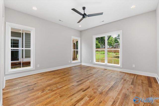 unfurnished room with ceiling fan and light wood-type flooring