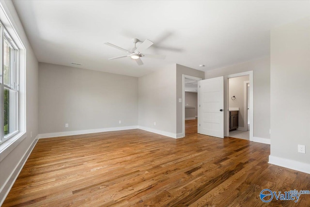 spare room featuring hardwood / wood-style flooring and ceiling fan