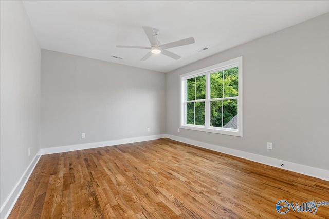 empty room featuring light hardwood / wood-style flooring and ceiling fan