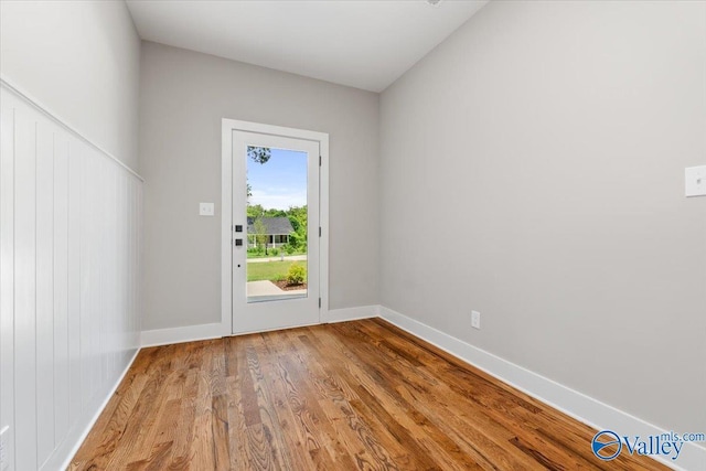 doorway with hardwood / wood-style floors