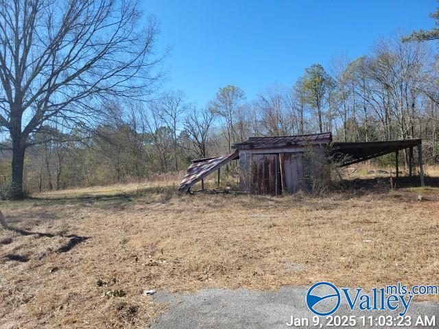 view of outdoor structure with a carport