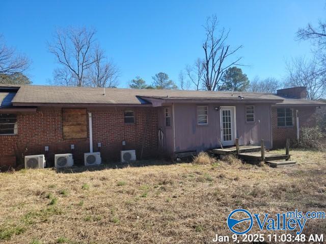 back of property featuring ac unit