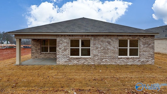 111 Wellspring Rd, Huntsville, AL 35810 - rear view of house featuring a patio, a shingled roof, and brick siding