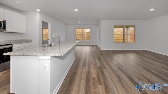 111 Wellspring Rd, Huntsville, AL 35810 - kitchen with a sink, stainless steel appliances, open floor plan, white cabinets, and dark wood-style floors