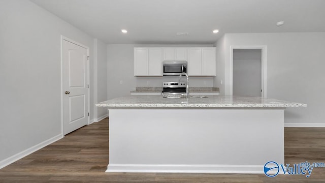 111 Wellspring Rd, Huntsville, AL 35810 - kitchen featuring stainless steel appliances, light stone countertops, dark wood-type flooring, white cabinetry, and recessed lighting