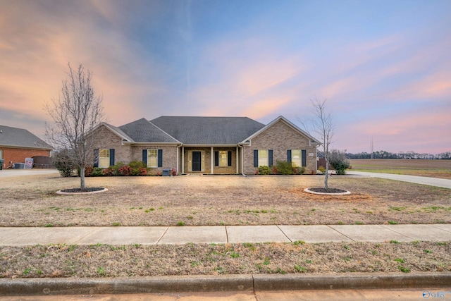 ranch-style house with brick siding