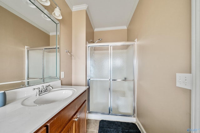 bathroom featuring tile patterned floors, a shower stall, vanity, and crown molding