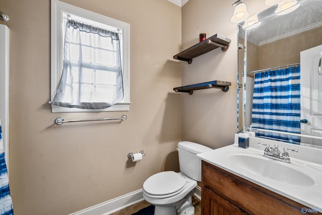 bathroom with toilet, curtained shower, baseboards, and vanity