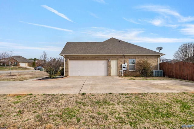 view of property exterior featuring central AC unit, a garage, brick siding, fence, and driveway