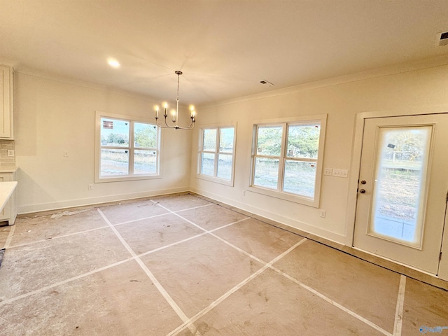 unfurnished dining area with a notable chandelier, baseboards, visible vents, and crown molding