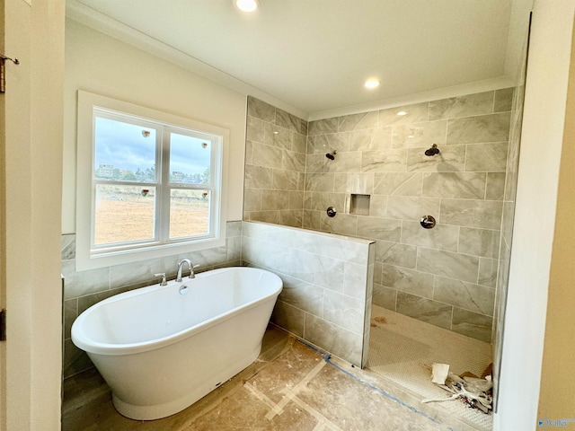 bathroom featuring a walk in shower, a freestanding tub, recessed lighting, tile walls, and ornamental molding