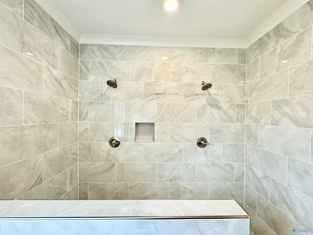 bathroom with tiled shower