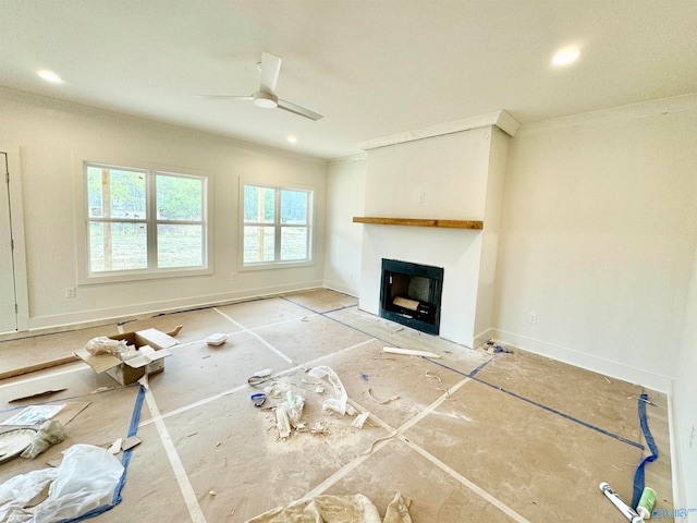 unfurnished living room with a fireplace with flush hearth, recessed lighting, crown molding, and a ceiling fan