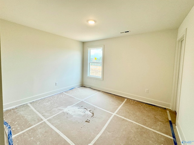 unfurnished bedroom with visible vents and baseboards