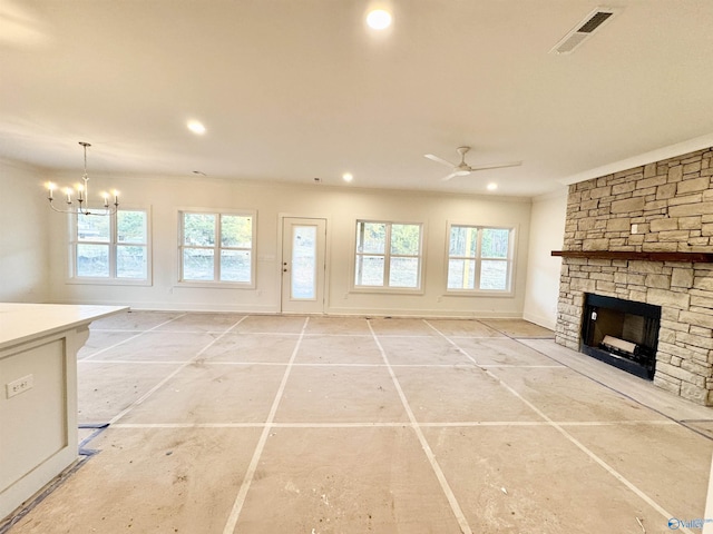 unfurnished living room featuring recessed lighting, ceiling fan with notable chandelier, a fireplace, visible vents, and ornamental molding