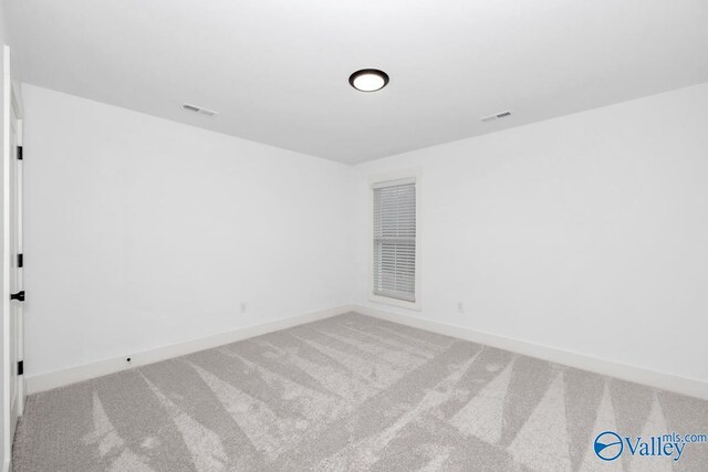 spare room with carpet flooring