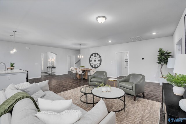 dining space featuring a notable chandelier and hardwood / wood-style floors