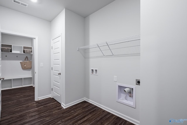 washroom featuring dark hardwood / wood-style floors, hookup for a washing machine, and electric dryer hookup