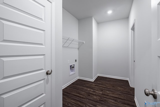 clothes washing area with dark wood-type flooring and hookup for an electric dryer