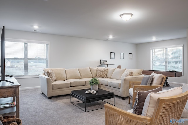 living room with light carpet and a wealth of natural light