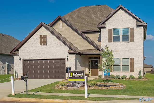 view of front of house featuring a garage and a front yard