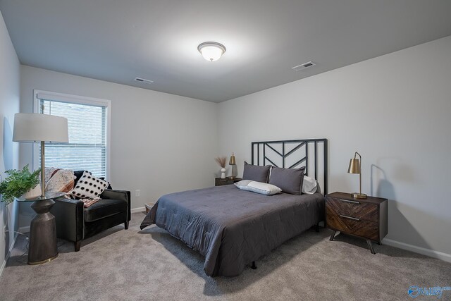 bedroom with light carpet