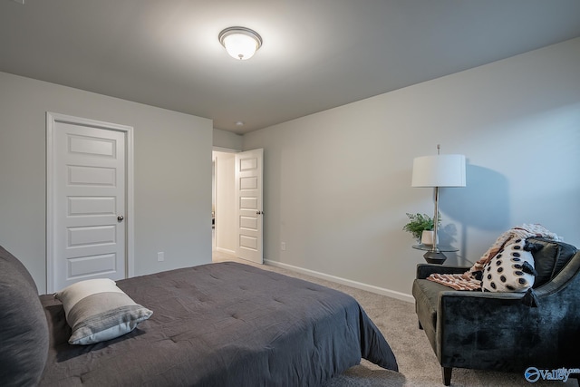 bedroom featuring light colored carpet