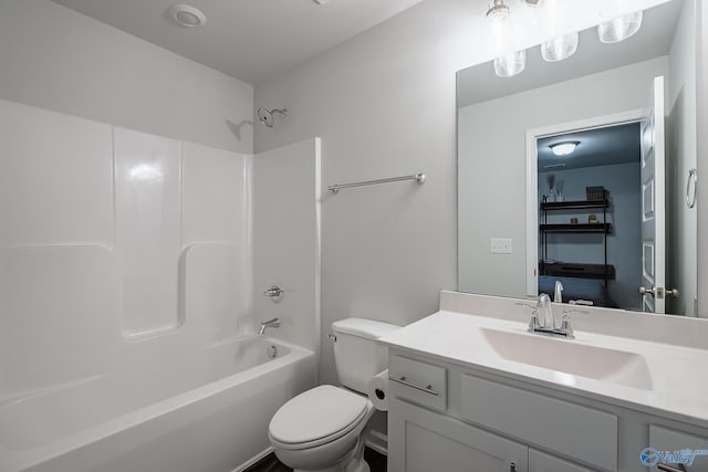 full bathroom featuring vanity, washtub / shower combination, and toilet