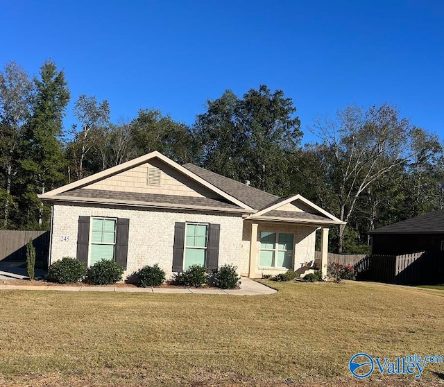 ranch-style home with a front yard