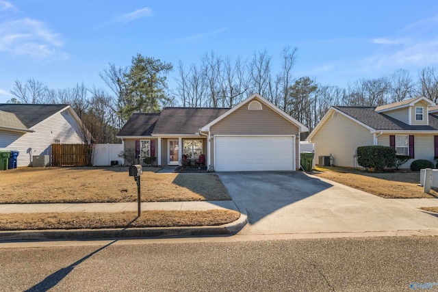 view of front of property with central AC unit and a garage