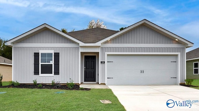 123 Trestle Point Dr, Harvest, AL 35749 - view of front of home featuring a garage, a front yard, and driveway