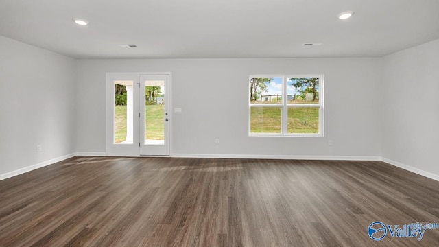 123 Trestle Point Dr, Harvest, AL 35749 - empty room with healthy amount of natural light, dark wood-style flooring, baseboards, and recessed lighting