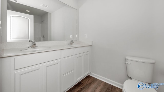 123 Trestle Point Dr, Harvest, AL 35749 - full bathroom with toilet, baseboards, wood finished floors, and double vanity