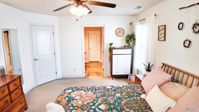 carpeted bedroom with ceiling fan