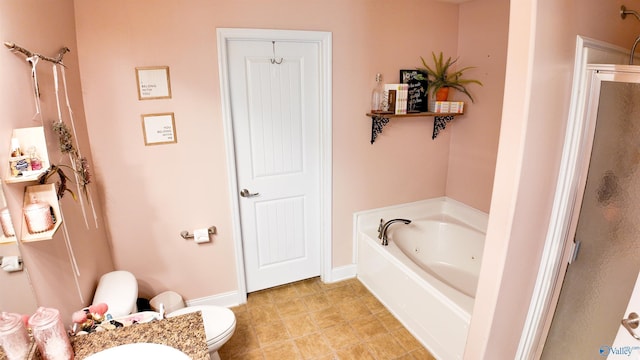 full bathroom with vanity, shower with separate bathtub, and toilet