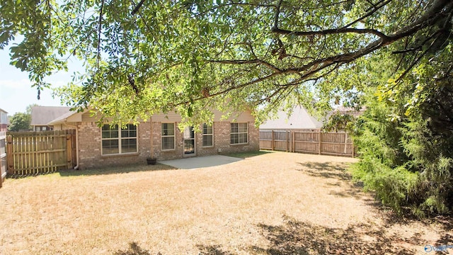 rear view of property with a patio area