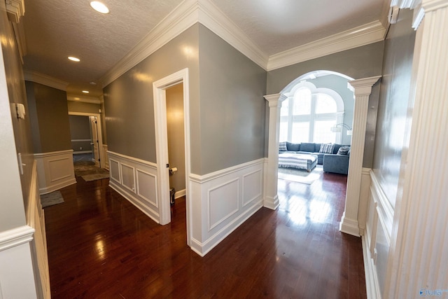 166 Hickory Rdg, Glencoe, AL 35905 - hall featuring ornate columns, dark wood-style floors, a decorative wall, recessed lighting, and a wainscoted wall