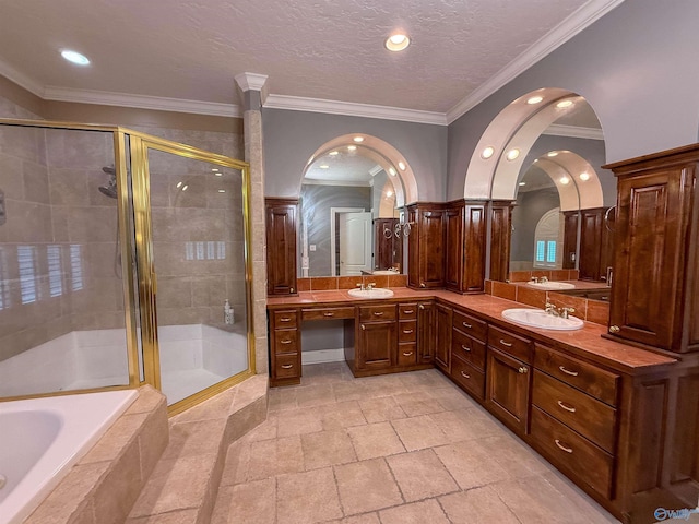 166 Hickory Rdg, Glencoe, AL 35905 - bathroom with a shower stall, double vanity, tiled bath, ornamental molding, and recessed lighting