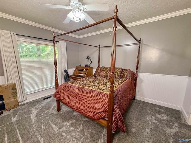 166 Hickory Rdg, Glencoe, AL 35905 - carpeted bedroom featuring crown molding, a wainscoted wall, ceiling fan, and a textured ceiling