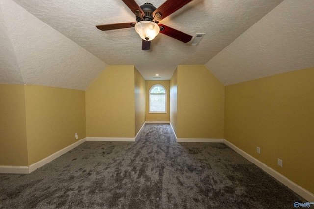 166 Hickory Rdg, Glencoe, AL 35905 - additional living space with a textured ceiling, carpet, vaulted ceiling, ceiling fan, and baseboards