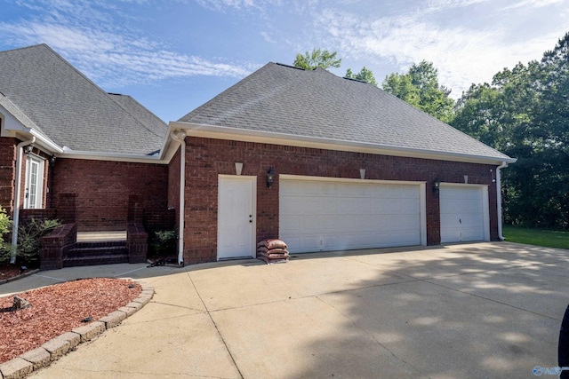 166 Hickory Rdg, Glencoe, AL 35905 - view of front of home with brick siding, concrete driveway, a garage, and a shingled roof