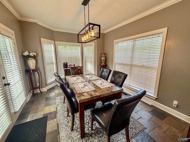 166 Hickory Rdg, Glencoe, AL 35905 - dining area featuring stone tile floors, baseboards, crown molding, and a chandelier