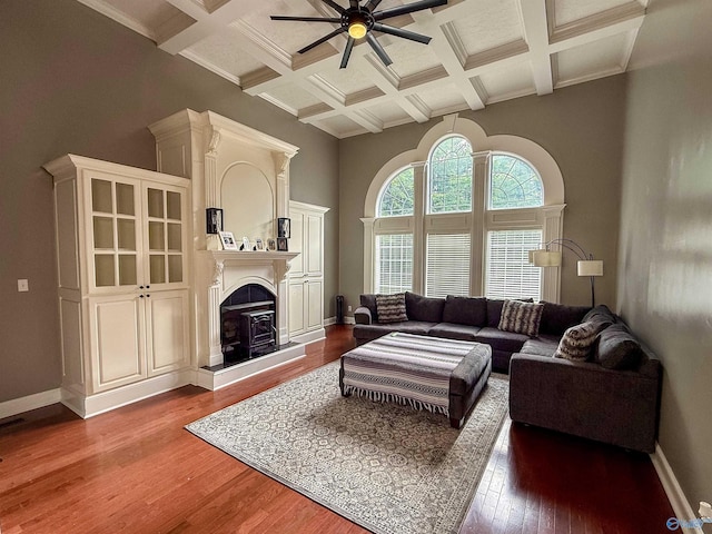 166 Hickory Rdg, Glencoe, AL 35905 - living area with a ceiling fan, coffered ceiling, hardwood / wood-style flooring, a fireplace with raised hearth, and a high ceiling